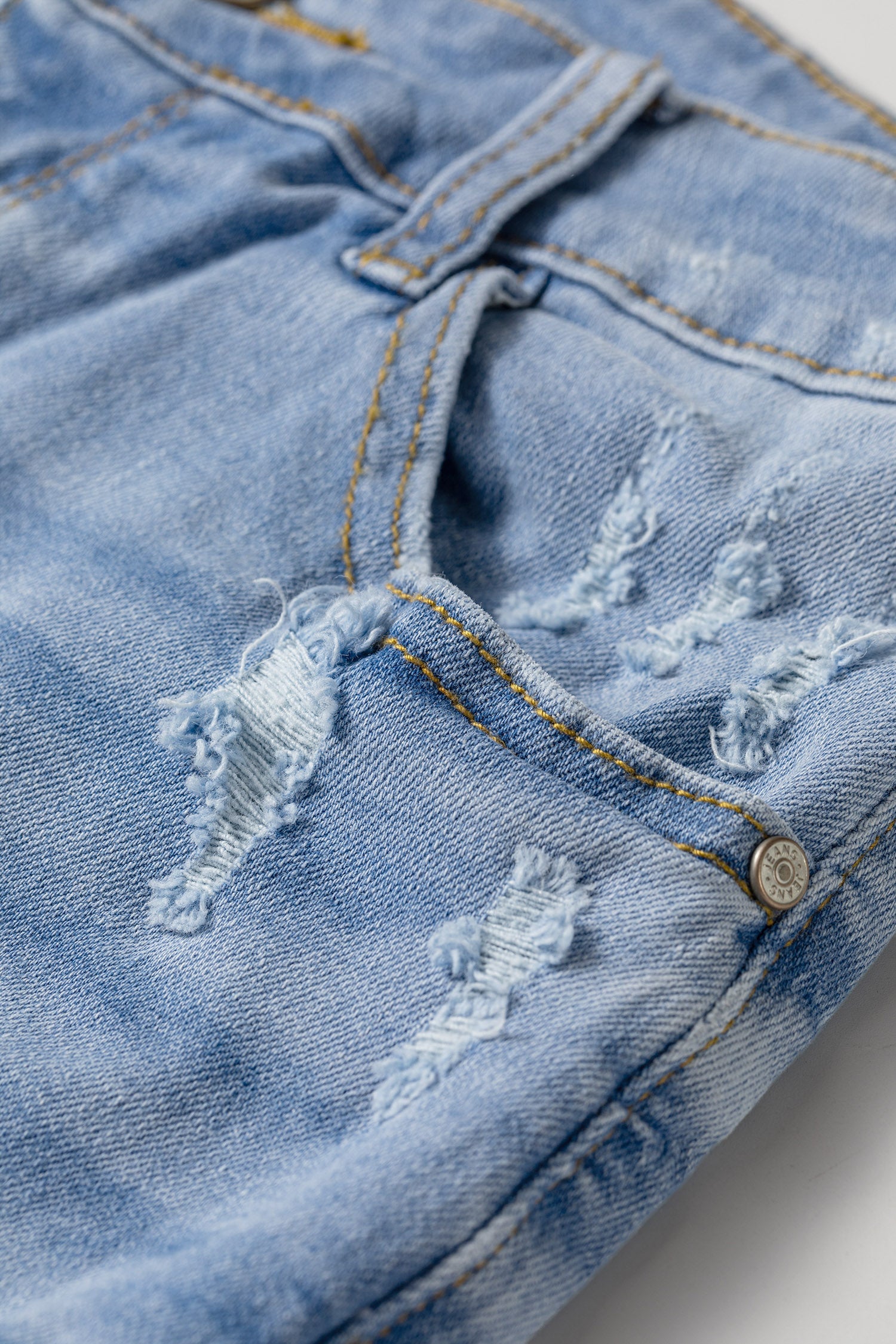 Distressed Denim Asymmetric Raw Hem Shorts