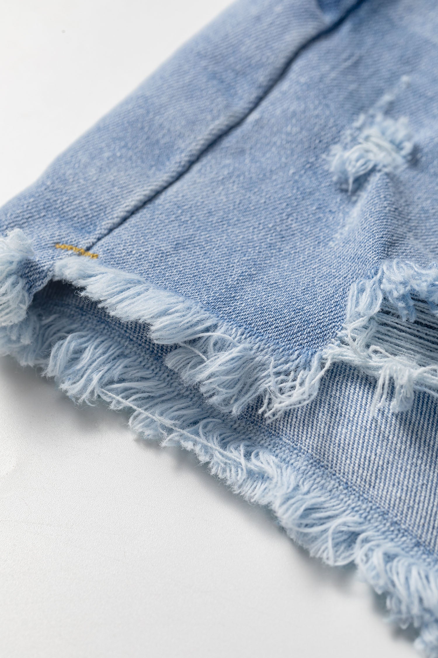 Distressed Denim Asymmetric Raw Hem Shorts
