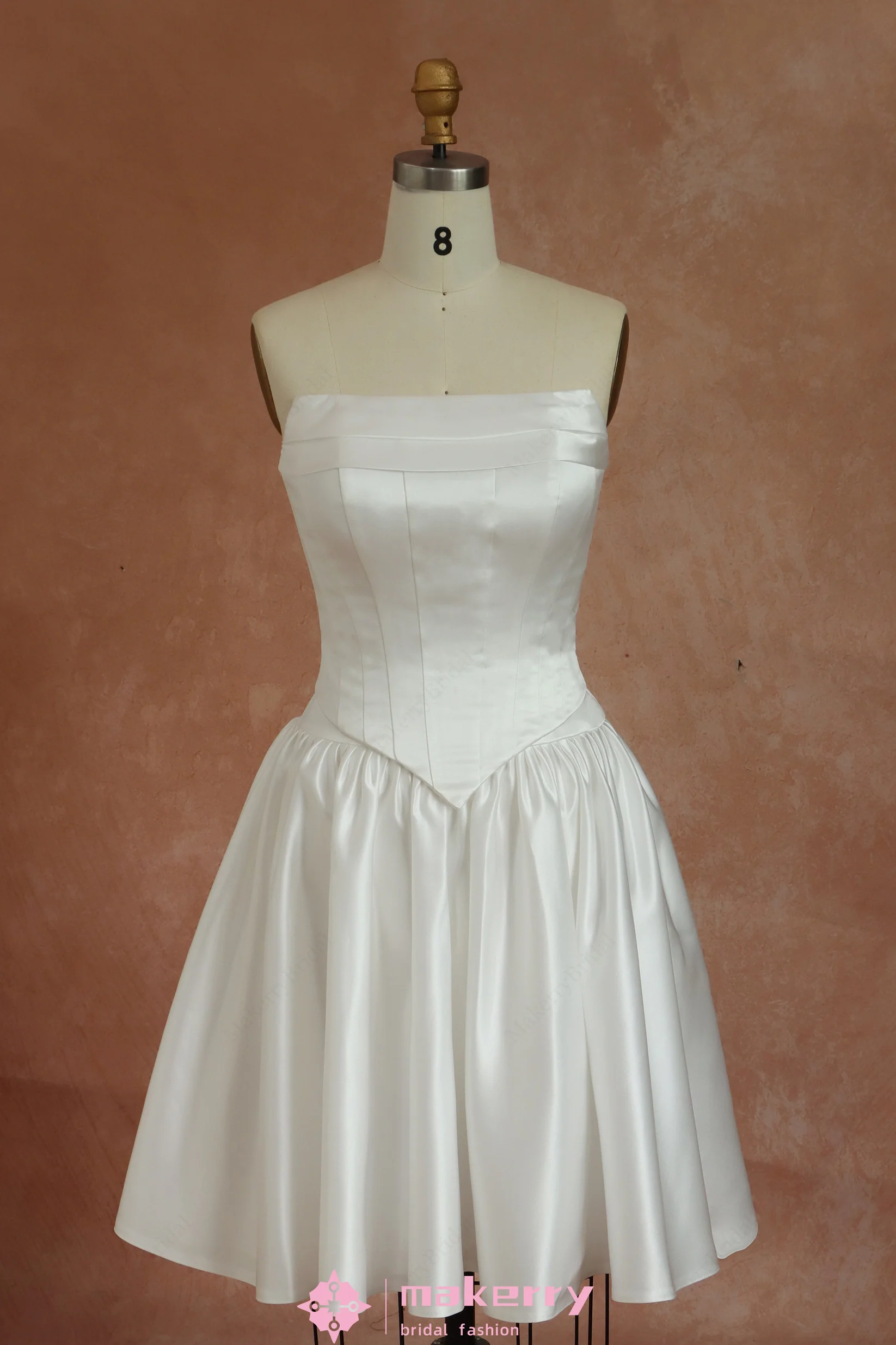Mini Bridal Dress With A Structured Corset Bodice And Pleated Skirt