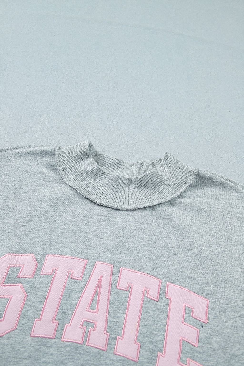STATE Embroidered Exposed Seam Mock Neck Sweatshirt