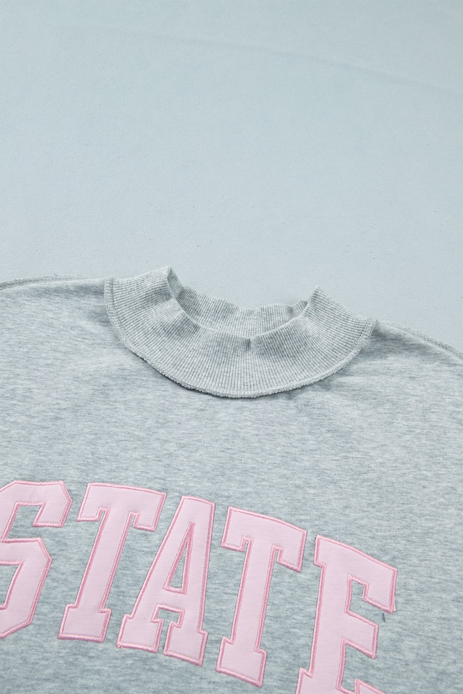 STATE Embroidered Exposed Seam Mock Neck Sweatshirt