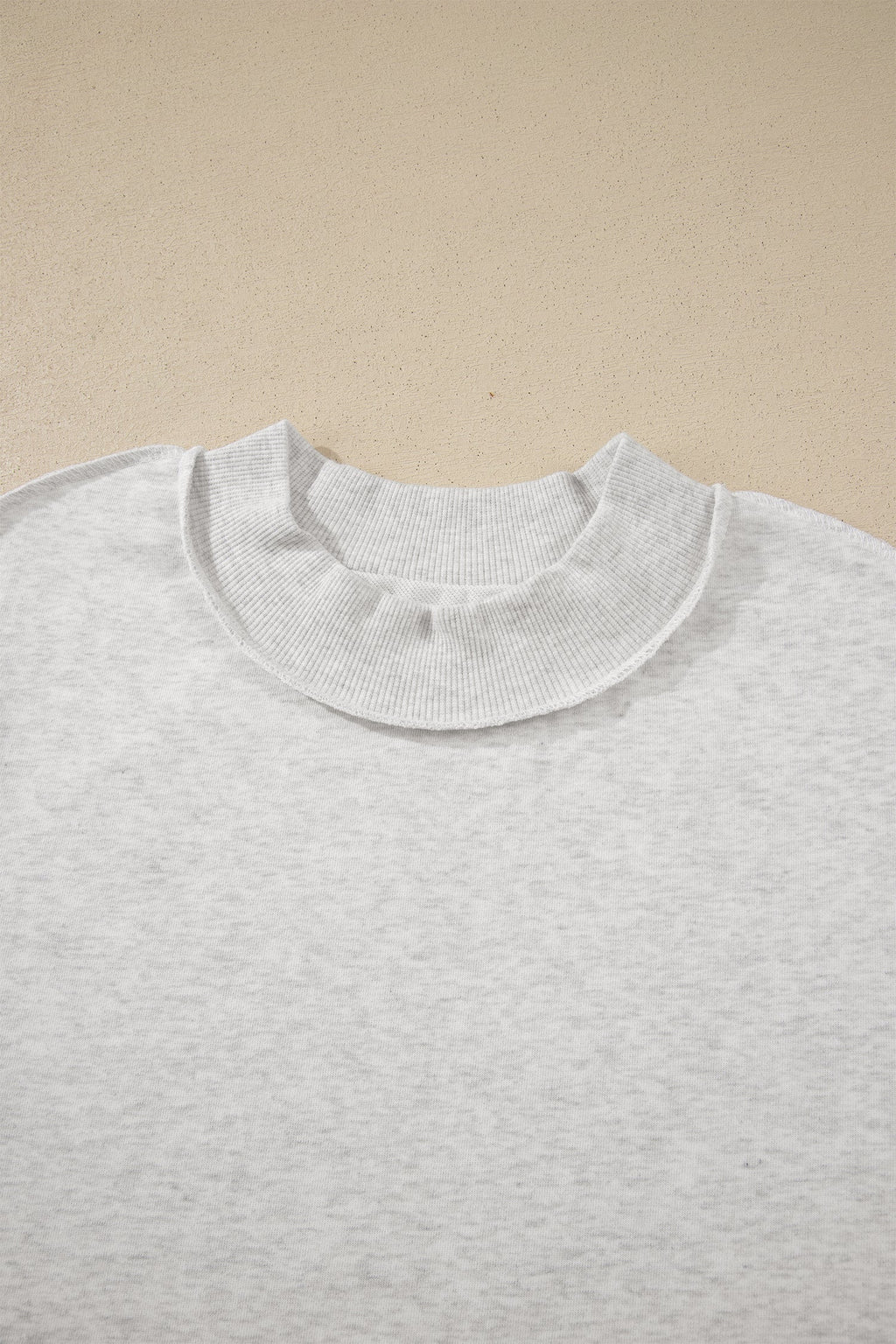 Solid Exposed Seam Mock Neck Tee