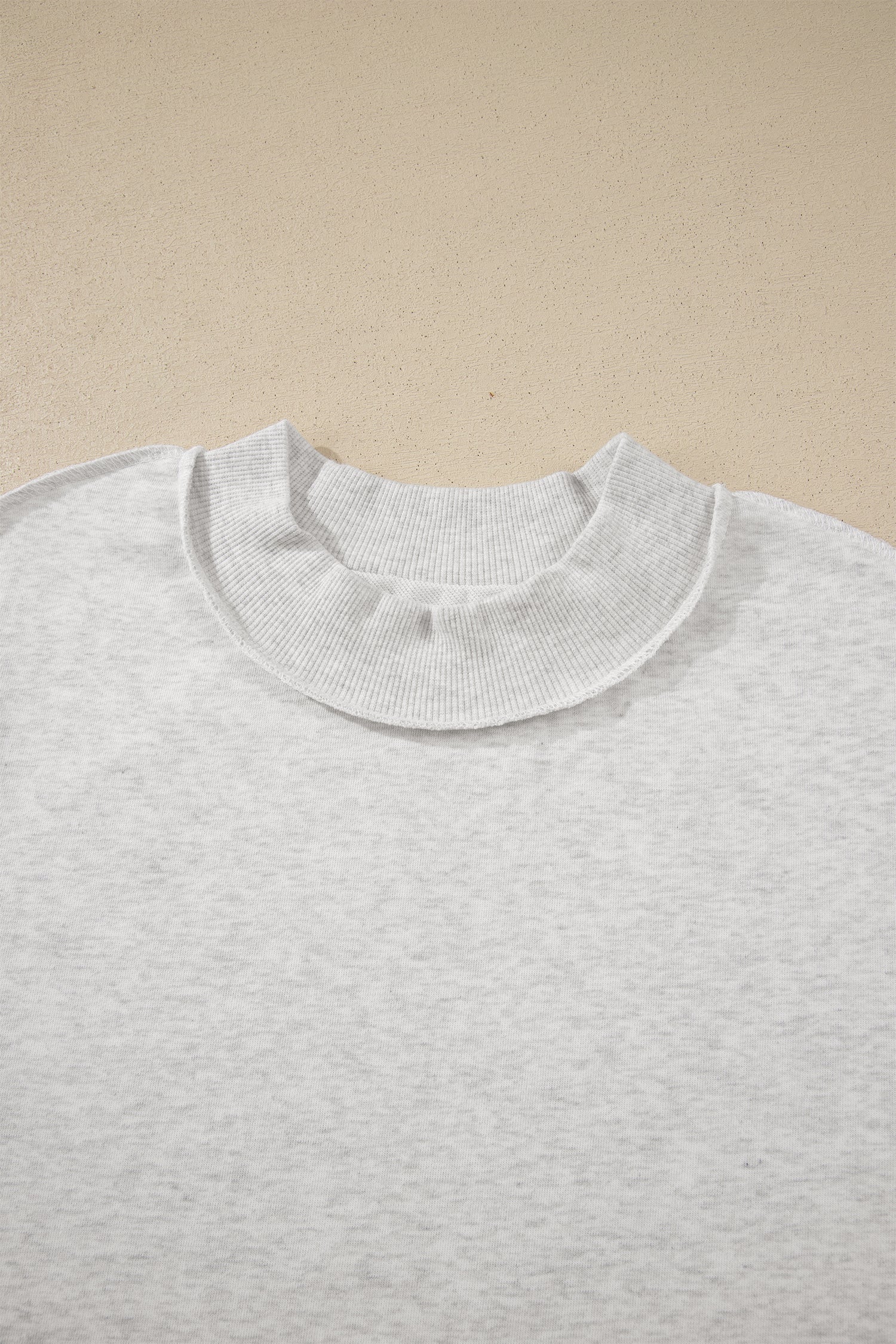 Solid Exposed Seam Mock Neck Tee