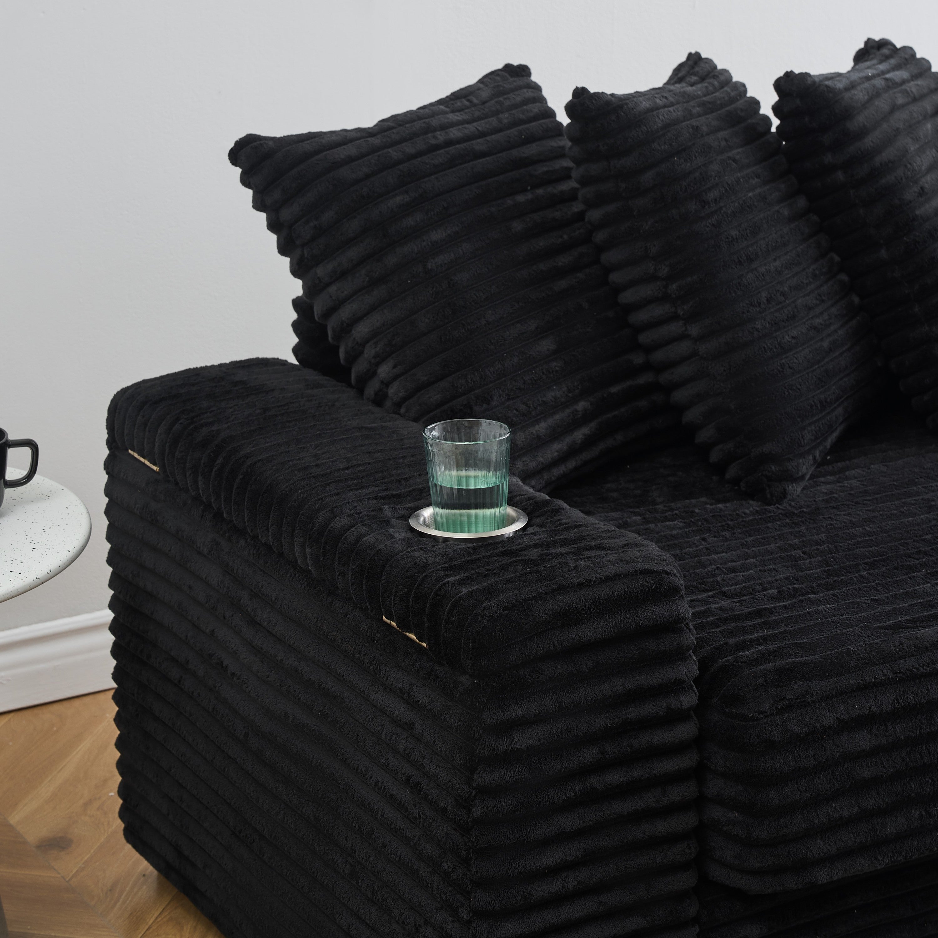 111.4 ' Black corduroy sofa, armrest with cup holder and storage function, recliner can be changed left and right, suitable for living room bedroom lounge area