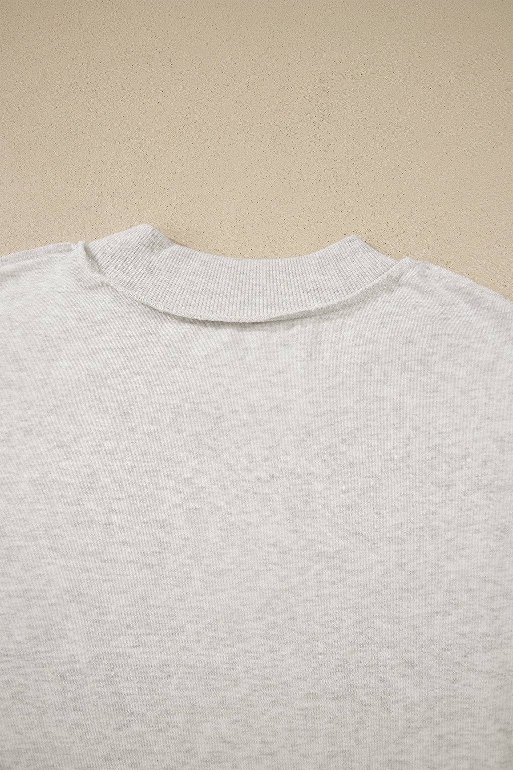 Solid Exposed Seam Mock Neck Tee