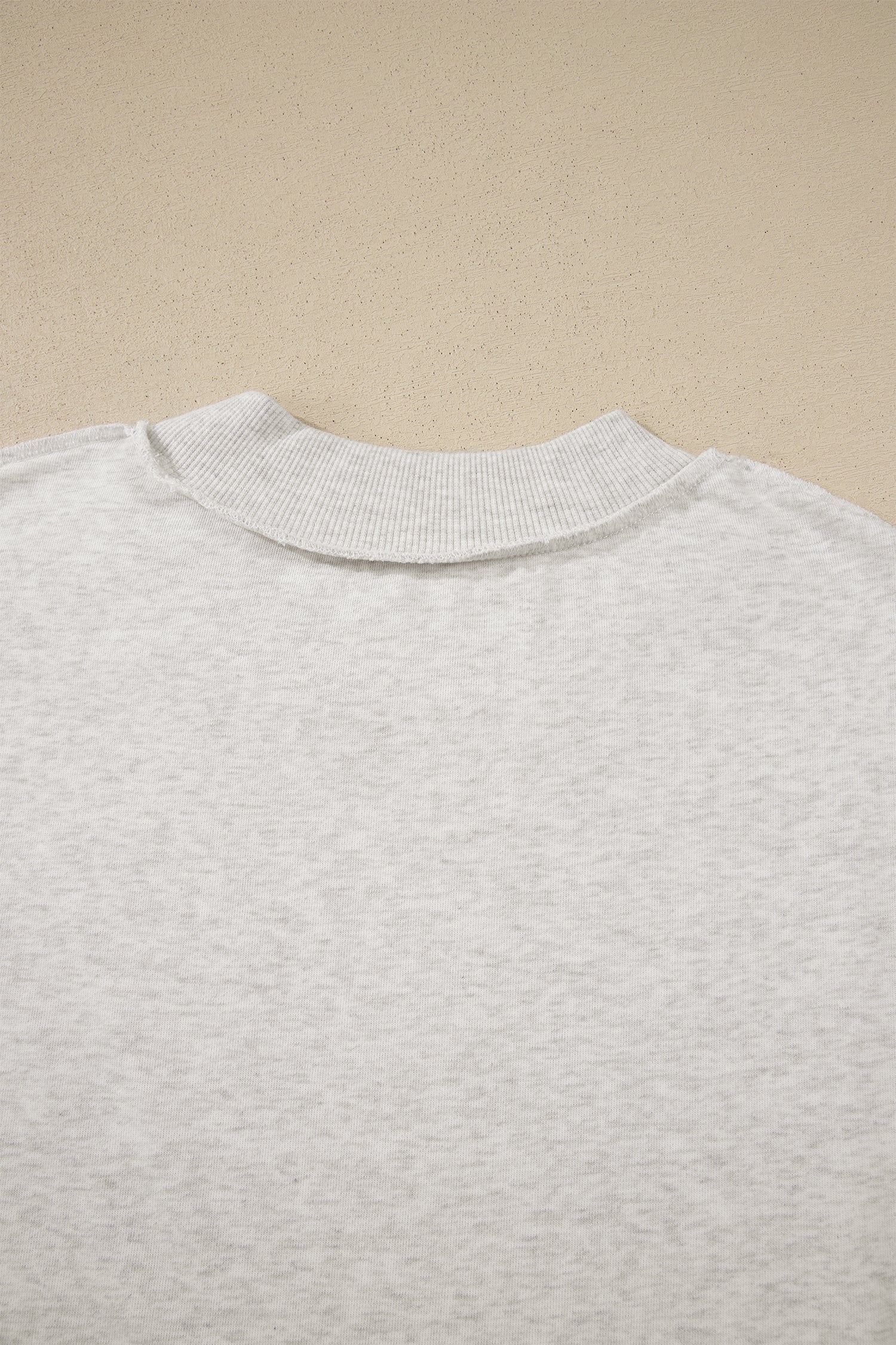 Solid Exposed Seam Mock Neck Tee